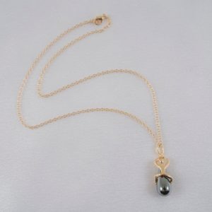 Secret Passion hematite pearl pendant gold